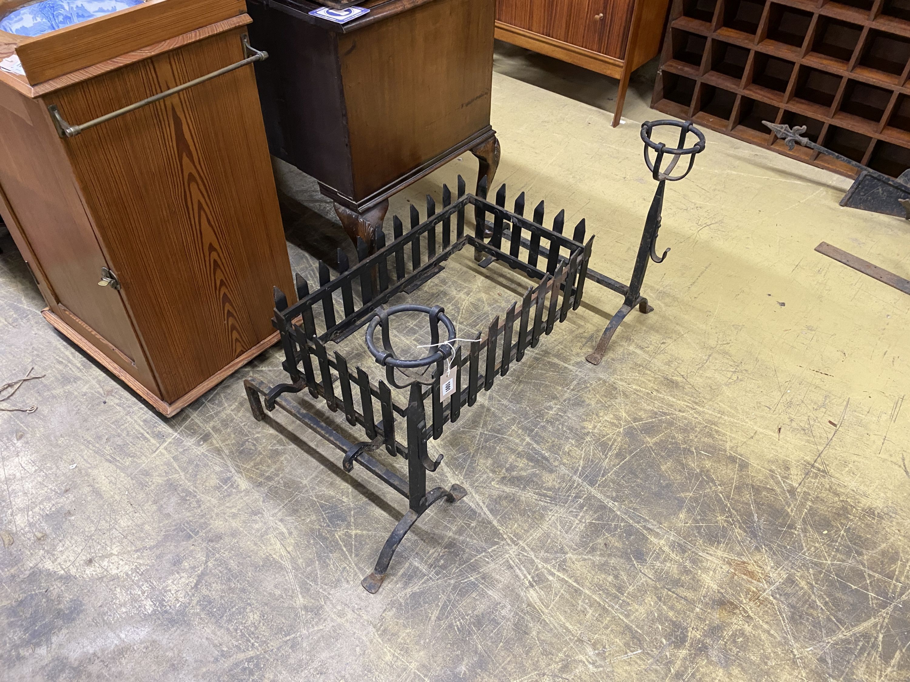 A wrought iron fire basket, width 71cm, depth 41cm, height 36cm and a pair of fire dogs